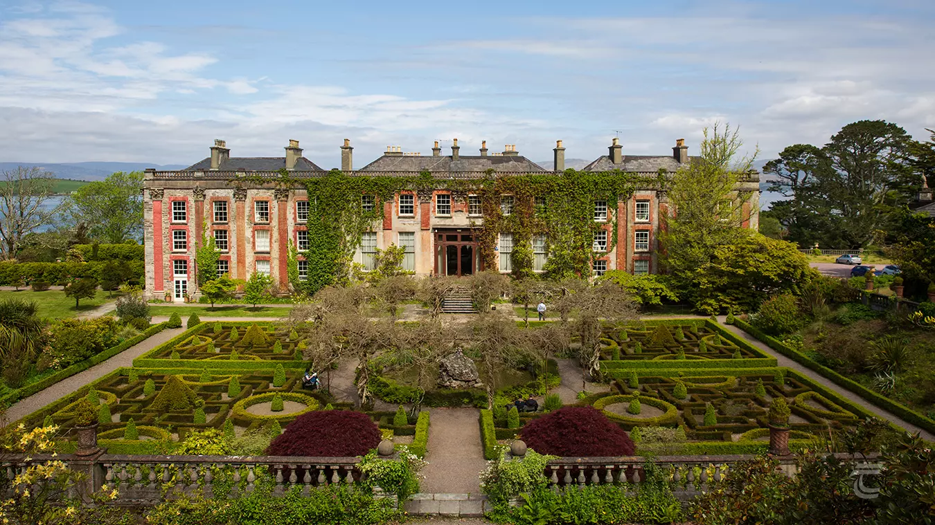 The landscaped gardens of Bantry House with Bantry Bay in the background