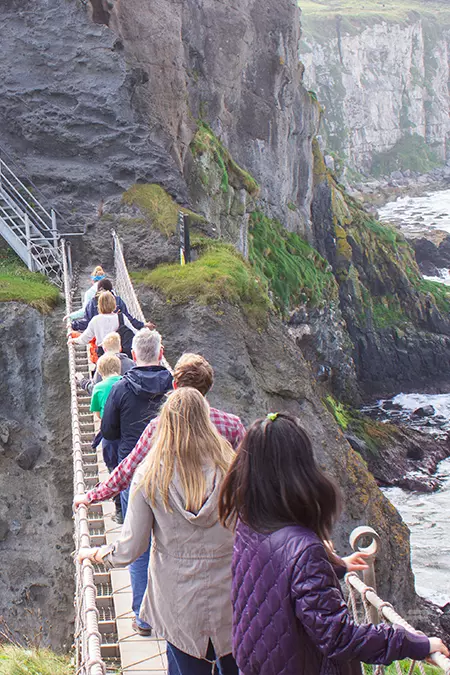 People queueing to cross the Carrick-a-Rede Rope Bridge on the Causeway Coast, Antrim.
