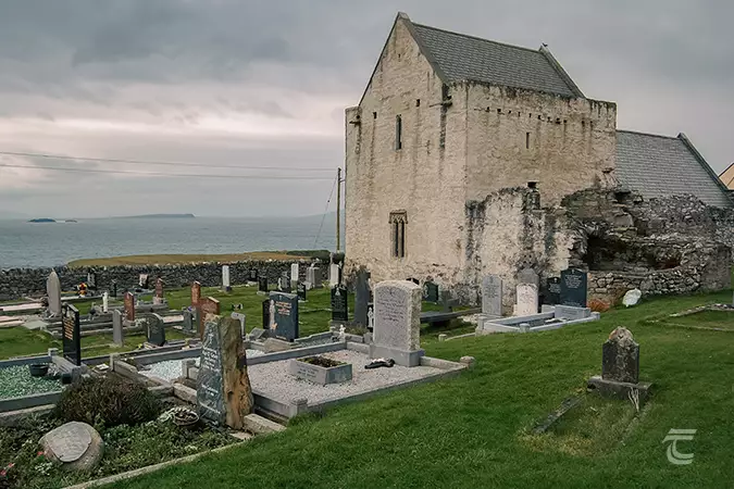 Clare Island Abbey, Mayo, with the graveyard in front of it.
