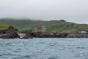 Approaching Clare Island, Mayo, with the medieval towerhouse, Granuaile's Castle visible on the coastline.