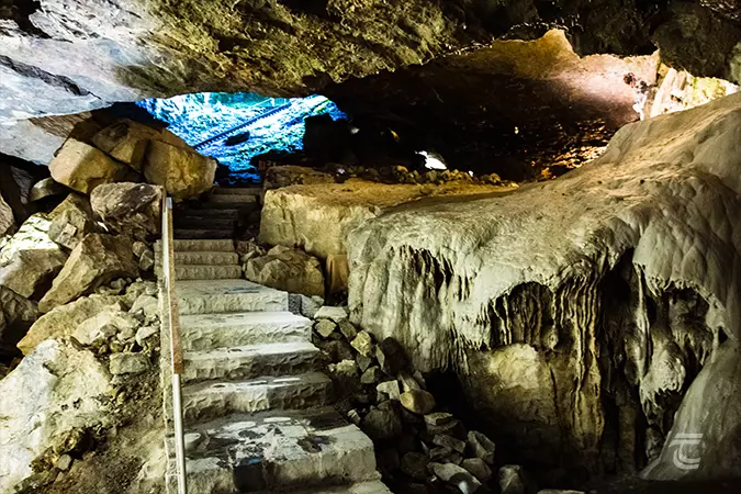 A staircase and walkway within the cave