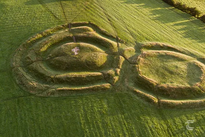 Aerial view of the Forradh a bivallated earthwork enclosure surrounding a steep mound on the Hill of Tara