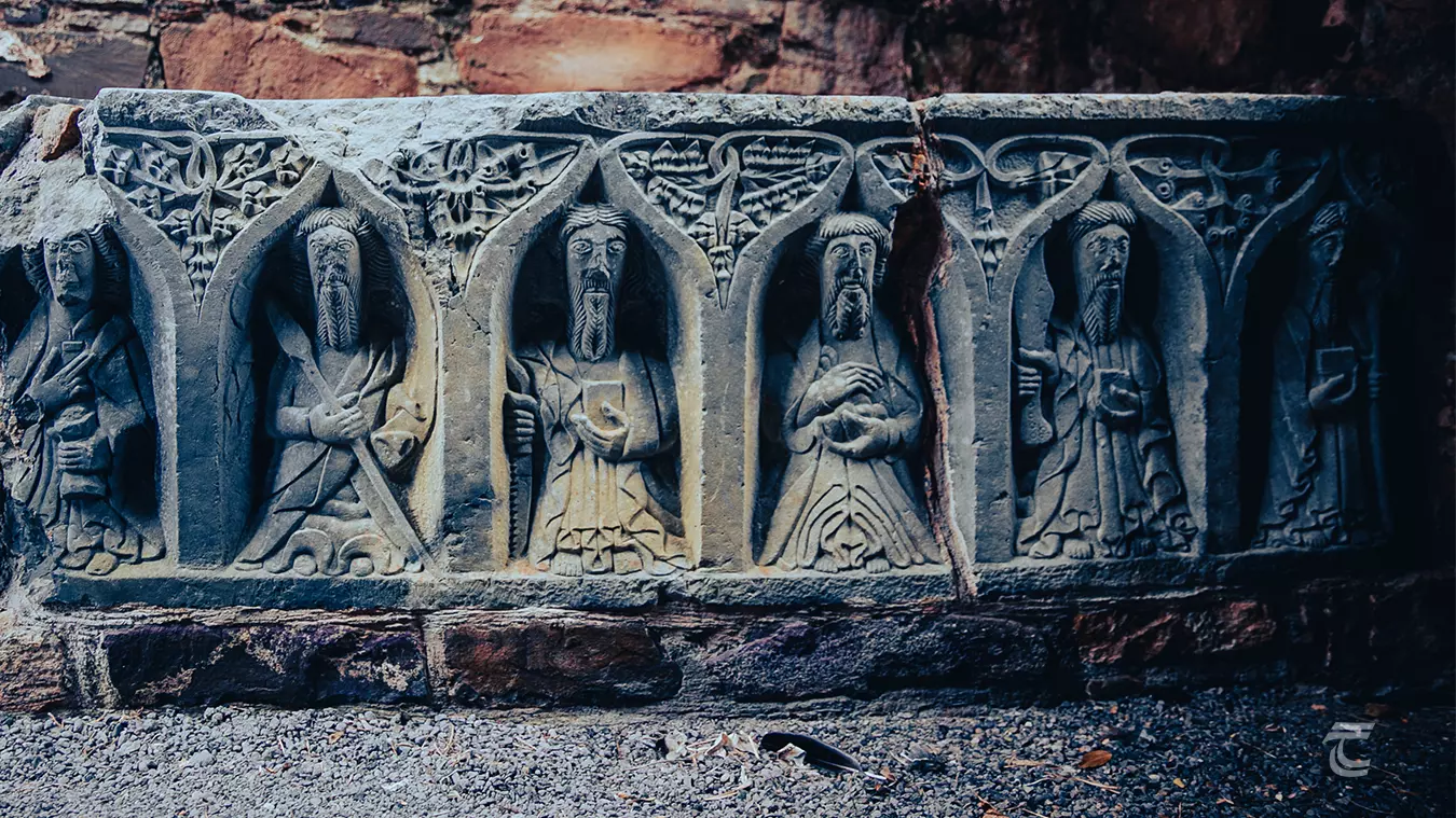 Decorative sculptures known as 'weepers' at the base of a tomb at Jerpoint Abbey 