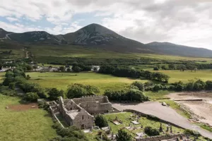 A high aerial view of Murrisk Friary, with Croagh Patrick in background, Mayo.