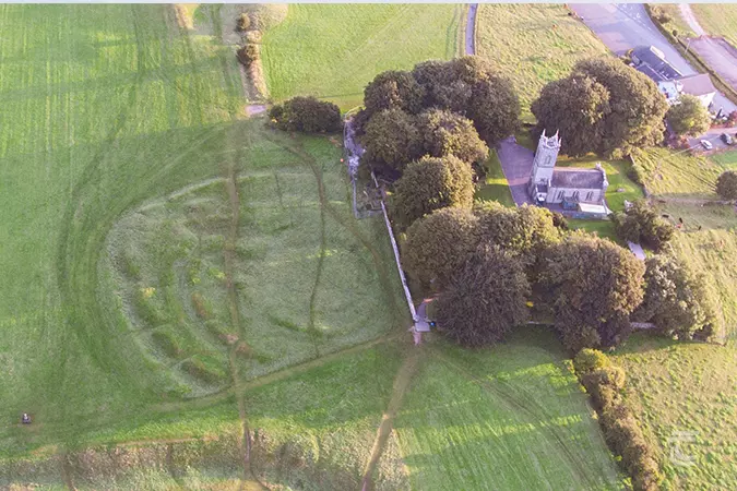 Aerial view of the uneven earthworks known as the Rath of the Synods on the Hill of Tara