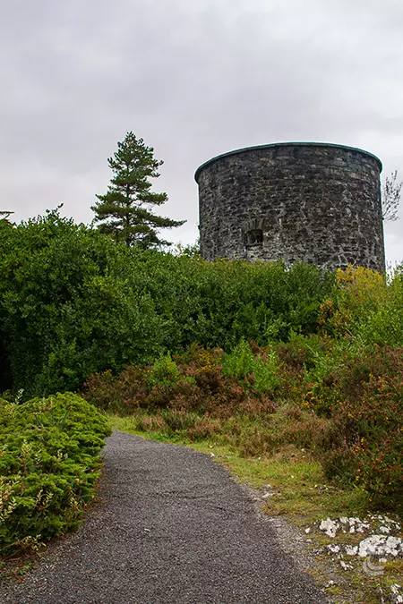 A Martello tower stands over the walled gardens of Garnish Island gardens