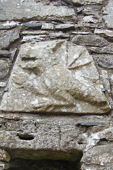 Carving of a dragon on the Hill of Slane
