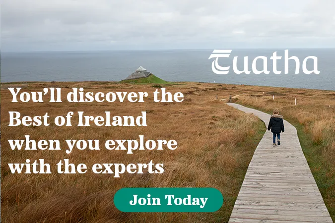 The image shows a small boy walking along the walkway at the Ceide Fields towards the visitor centre. Embedded text reads You'll Discover the Best of Ireland when you explore with the experts, Join Today'