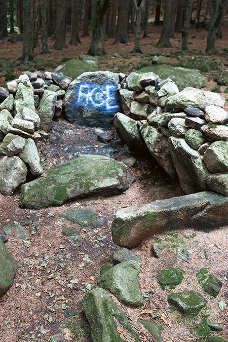 Vandalism of a monument Graffiti on Kilmashogue Wedge Tomb in the Dublin Mountains